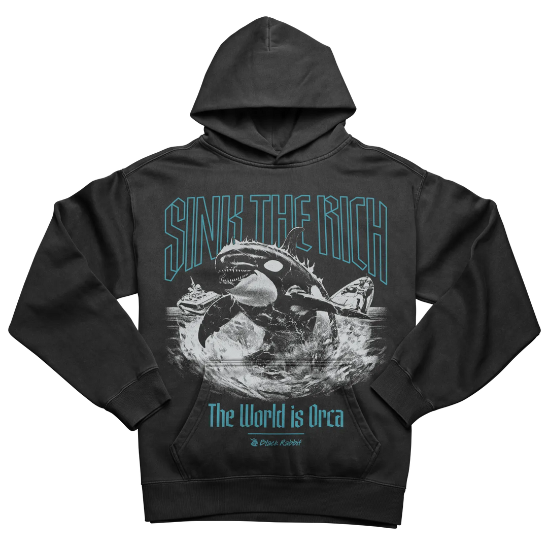 A black hooded sweatshirt with a graphic print of an orca and a sinking ship.