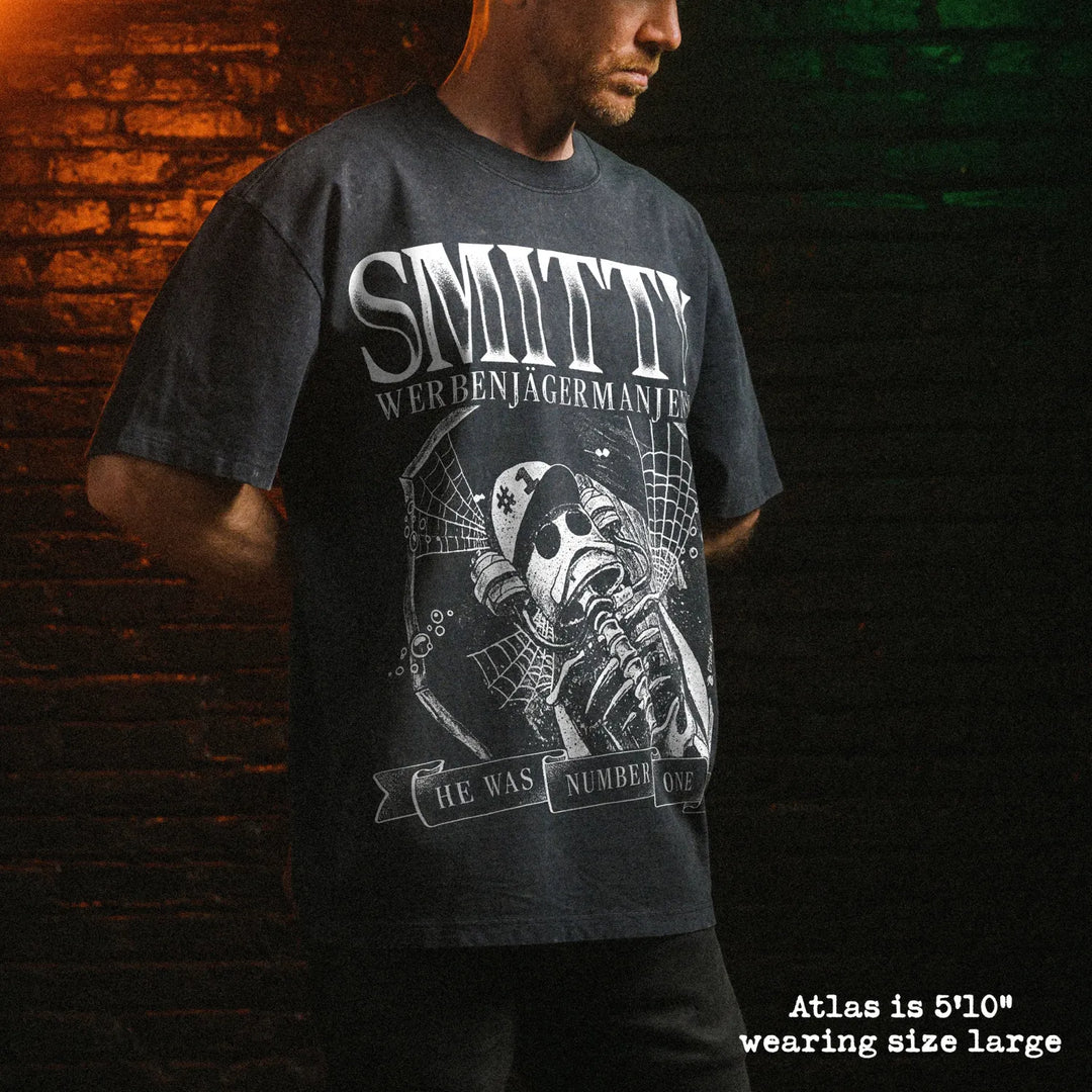 Male model wearing stone wash heavy tee with smitty graphic 