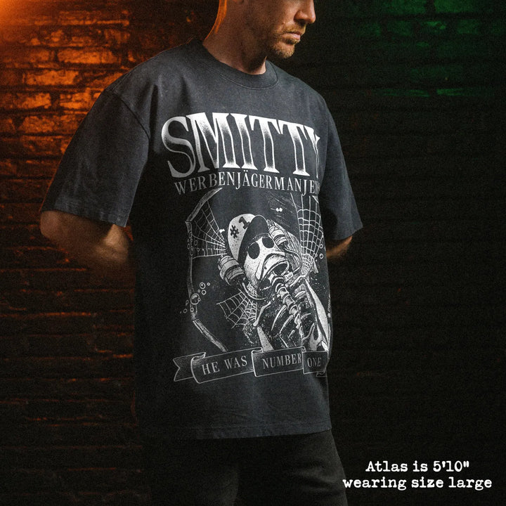Male model wearing stone wash heavy tee with smitty graphic 