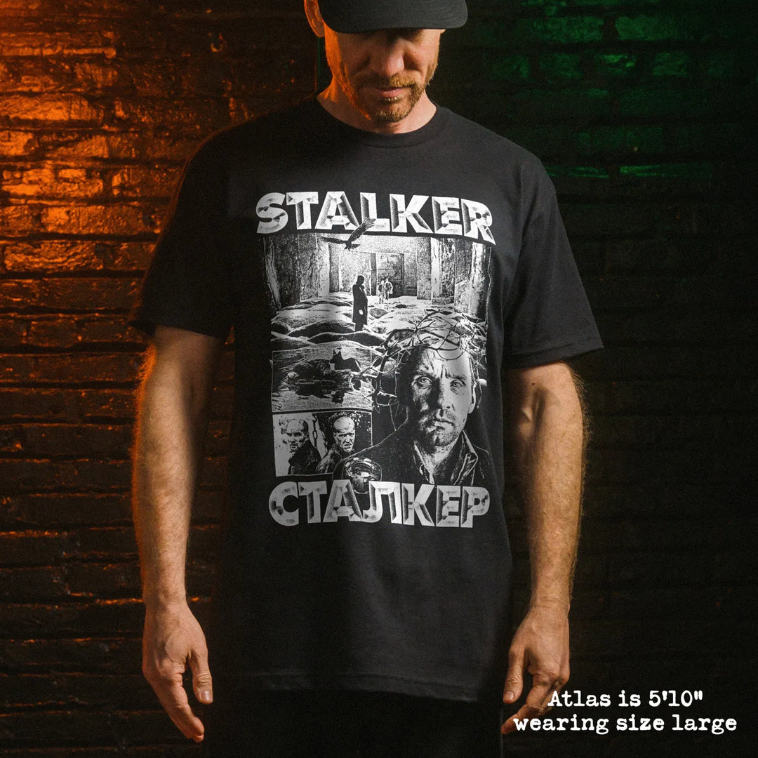 Male model wear soft premium tee with stalker graphic
