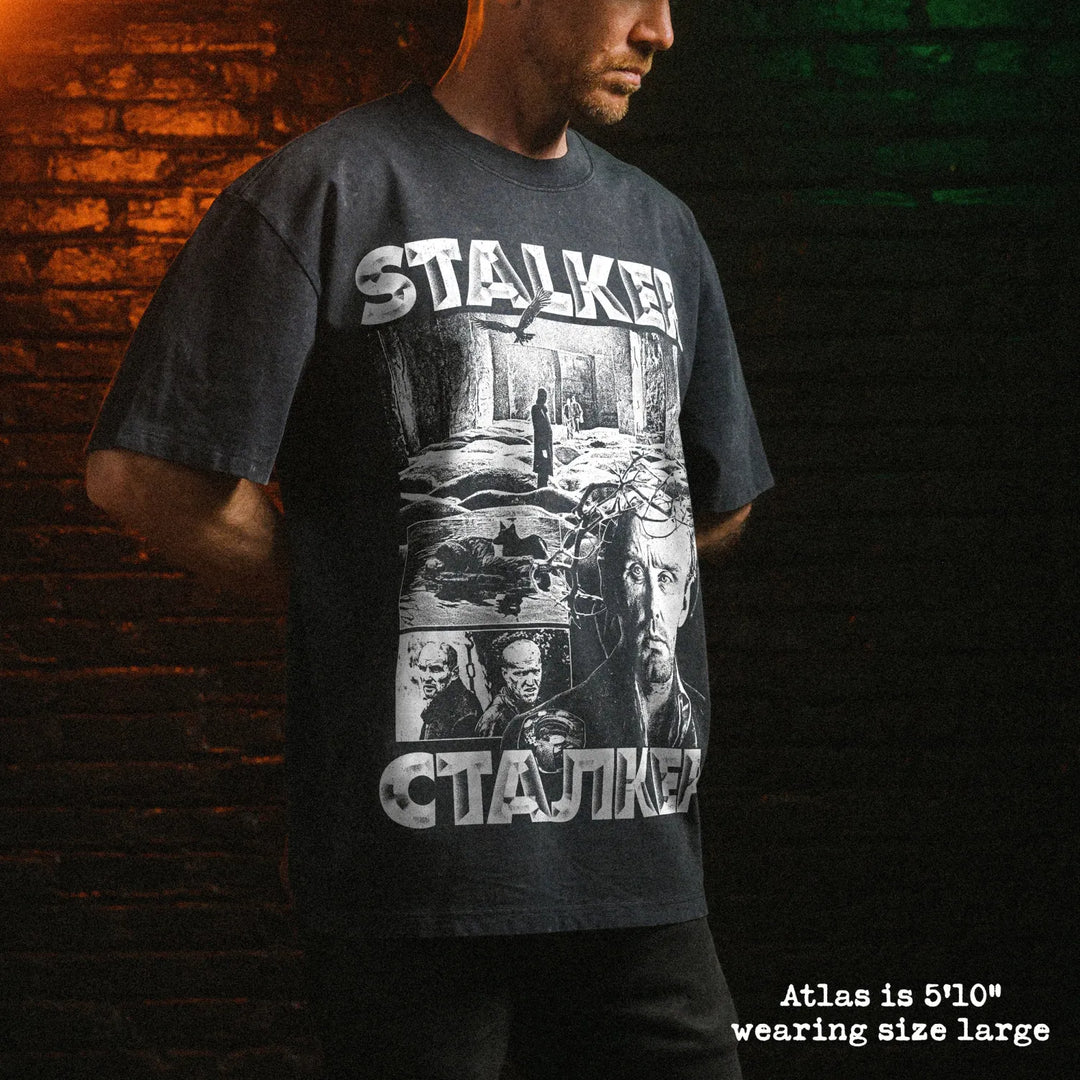 Male model wearing stone wash heavy tee with stalker graphic 