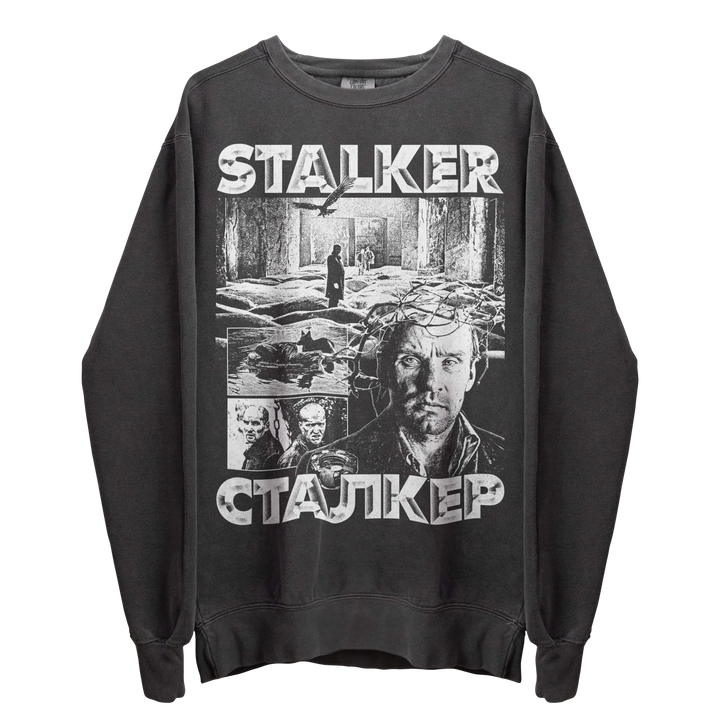Dark grey crewneck sweatshirt with a monochrome graphic print of scenes and characters from the film ’Stalker.’