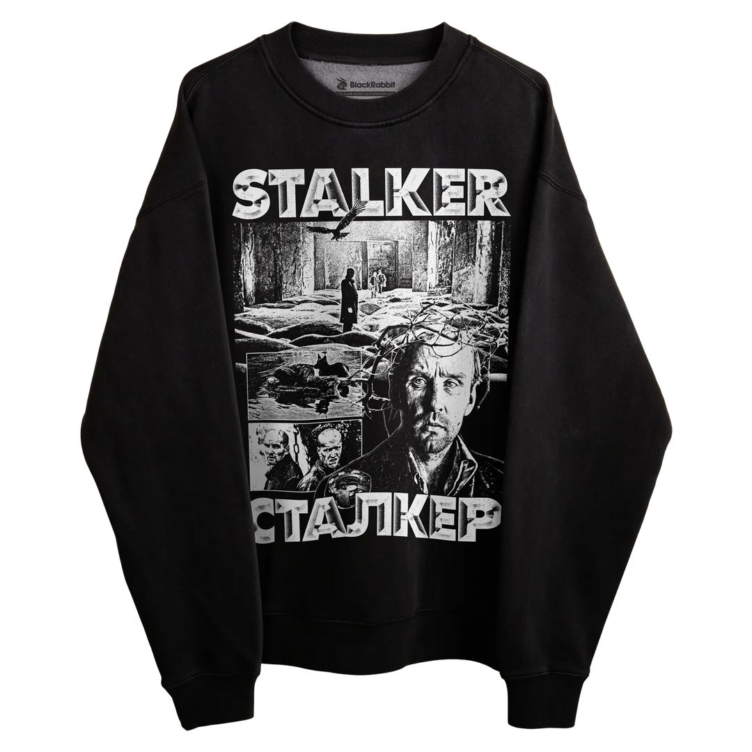 Black stalker sweatshirt with graphic design featuring multiple characters and the title ’stalker’ in white text.