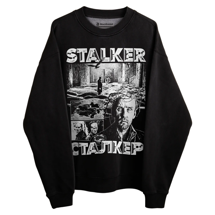 Black stalker sweatshirt with graphic design featuring multiple characters and the title ’stalker’ in white text.