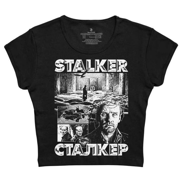 Black women’s t-shirt featuring a white graphic print of the movie ’stalker’ with russian text and imagery.