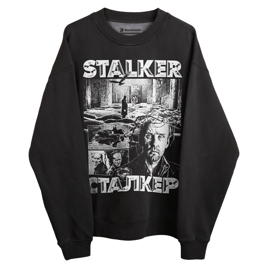 Black long-sleeved sweatshirt with ’stalker’ graphic design featuring multiple scenes and characters from the film.