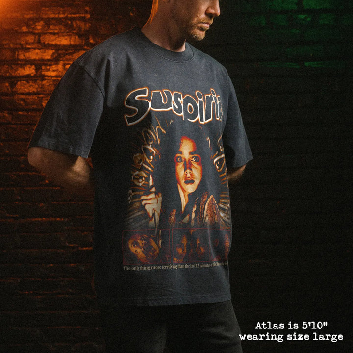 Male model wearing stone wash heavy tee with suspriria graphic 