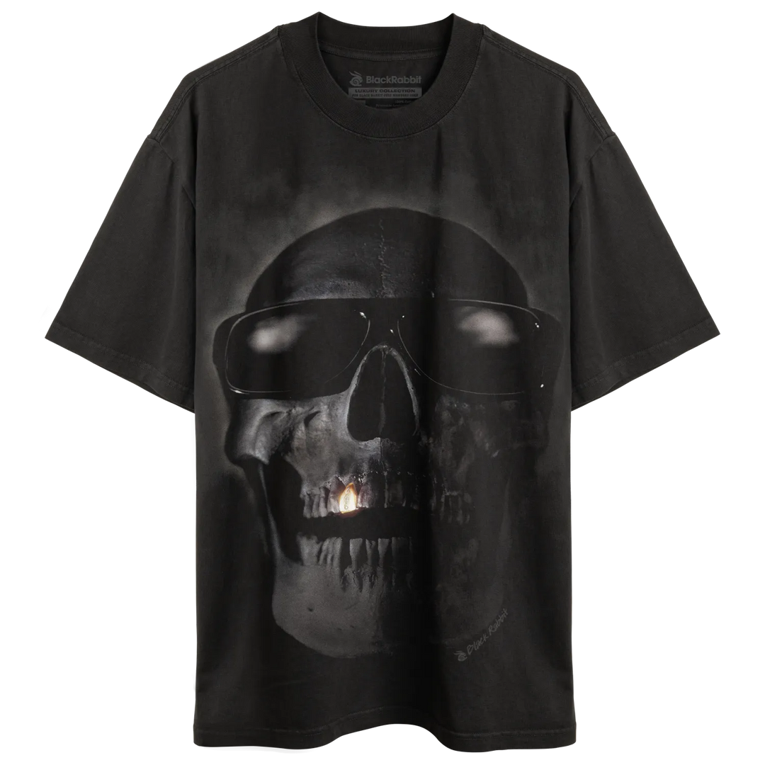 Black skull t-shirt with glowing eyes and mouth design, likely made of cotton.