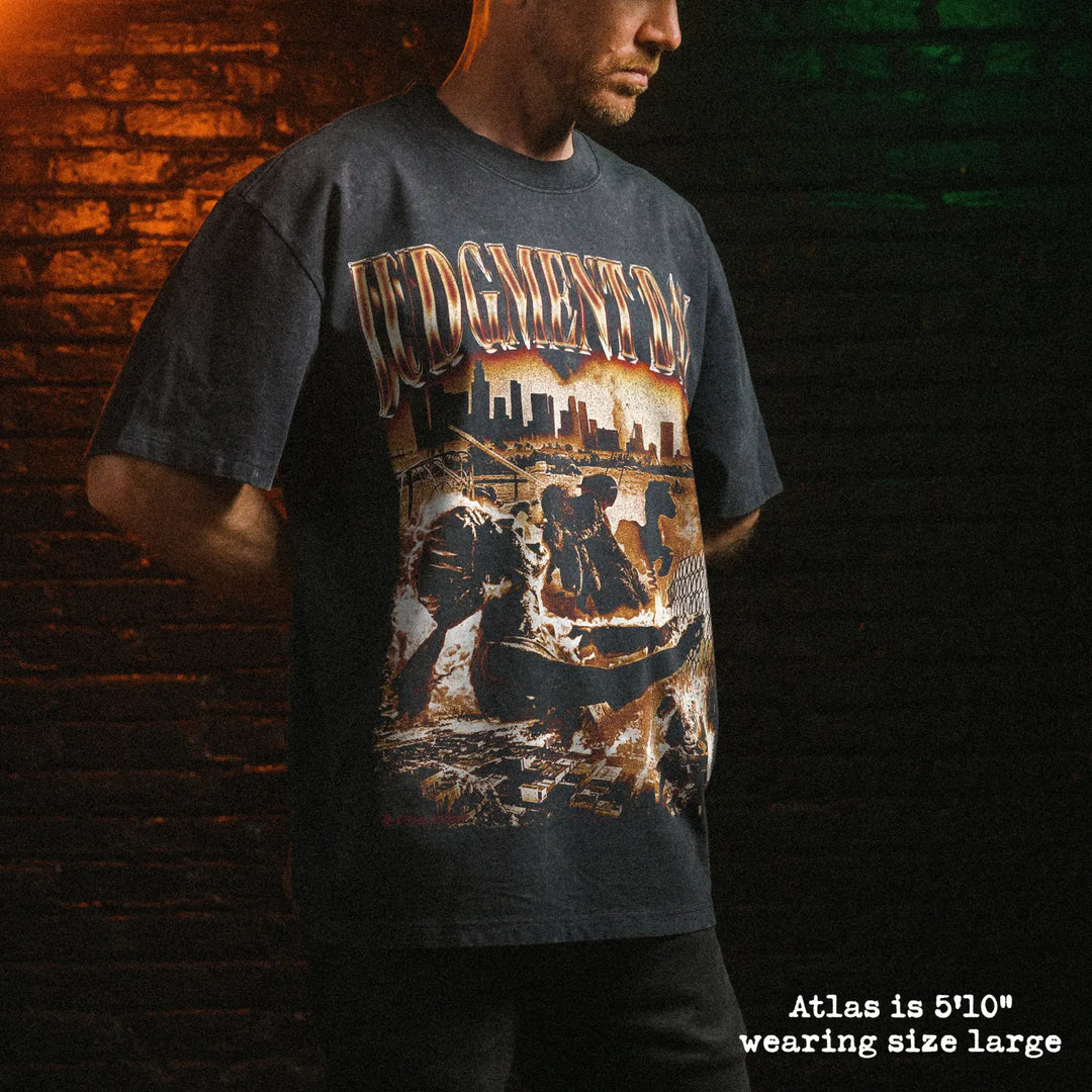 Male model wearing stone wash heavy tee with judgment day graphic 
