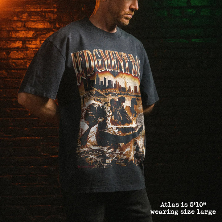 Male model wearing stone wash heavy tee with judgment day graphic 