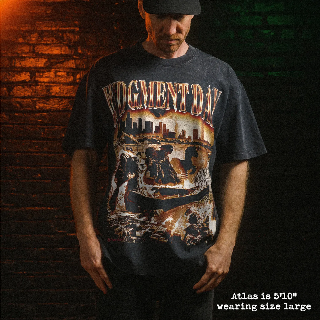 Male model wearing stone wash heavy tee with judgment day graphic 