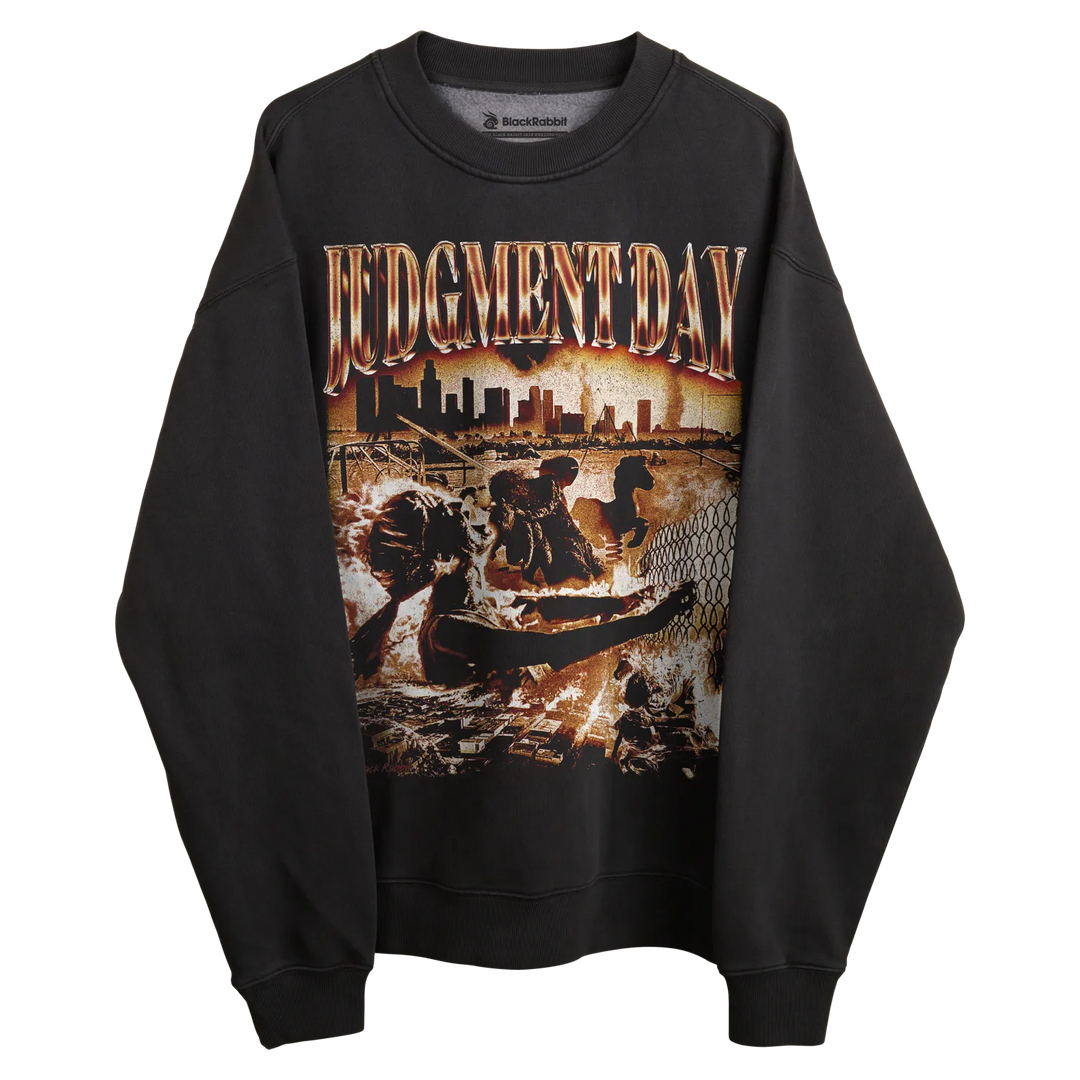 Black sweatshirt with ’judgment day’ graphic design featuring a cityscape and figures, likely made of cotton or polyester blend.