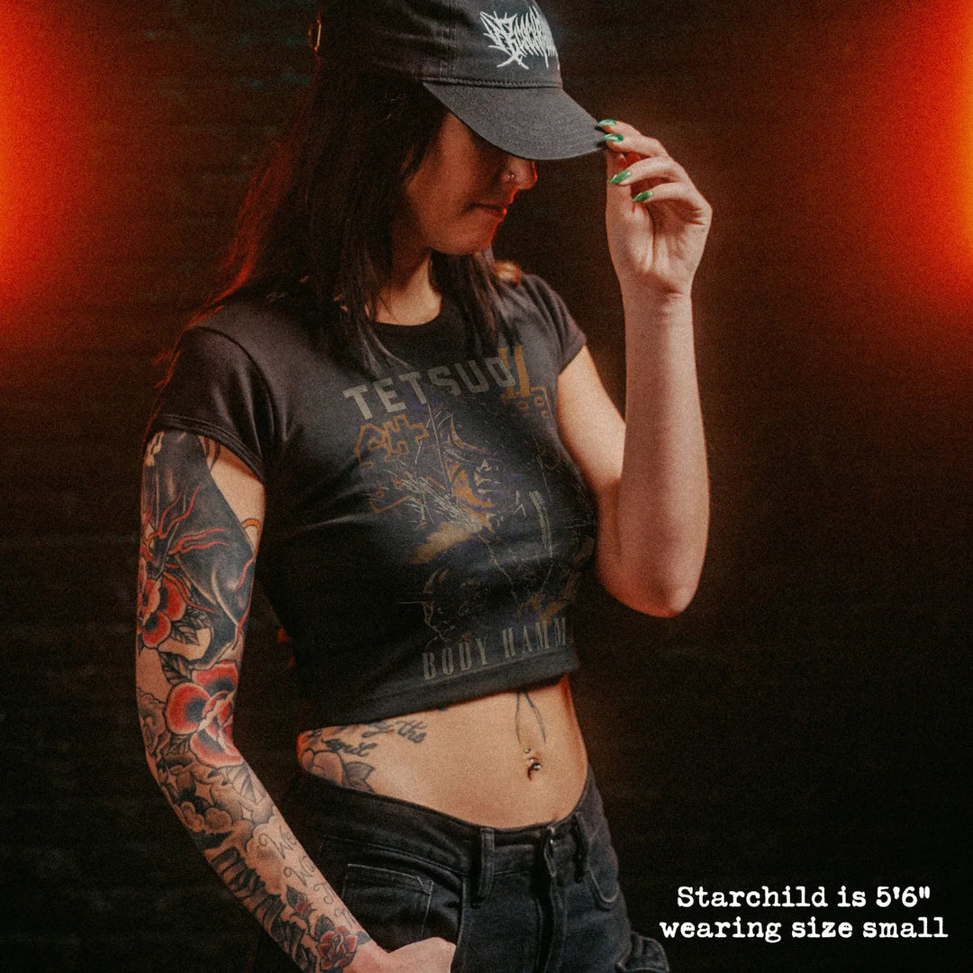 Female model wearing cropped baby tee with tetsuo II graphic
