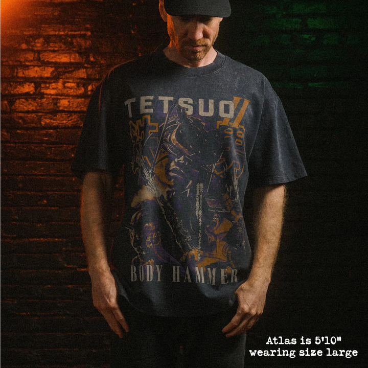 Male model wearing heavy stone washed tee with tetsuo II graphic. 