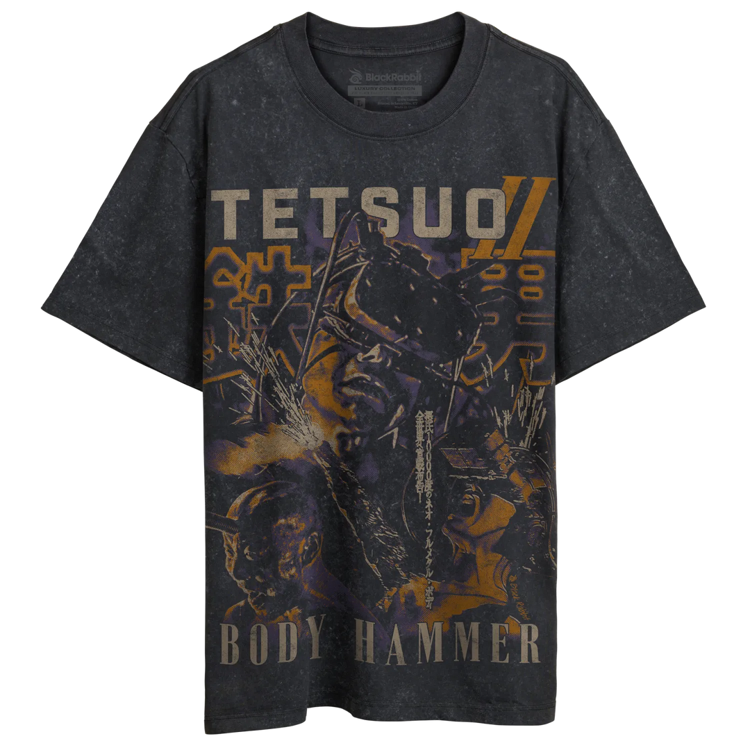 Black distressed t-shirt featuring a graphic print of the anime character tetsuo from ’body hammer’ with bold orange and yellow text. 