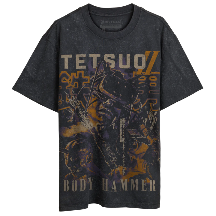 Black distressed t-shirt featuring a graphic print of the anime character tetsuo from ’body hammer’ with bold orange and yellow text. 