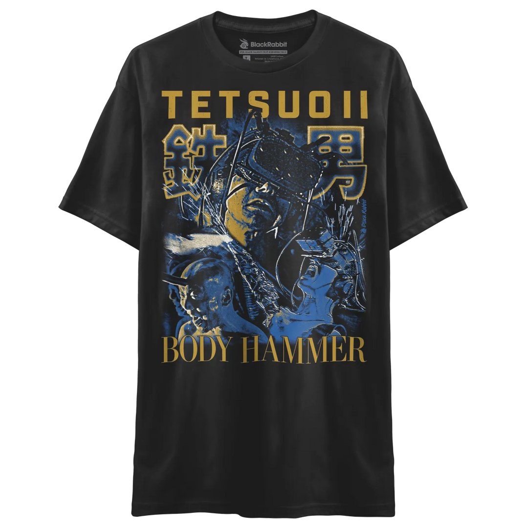 Black t-shirt with tetsuo ii graphic and text ’body hammer’ in gold.