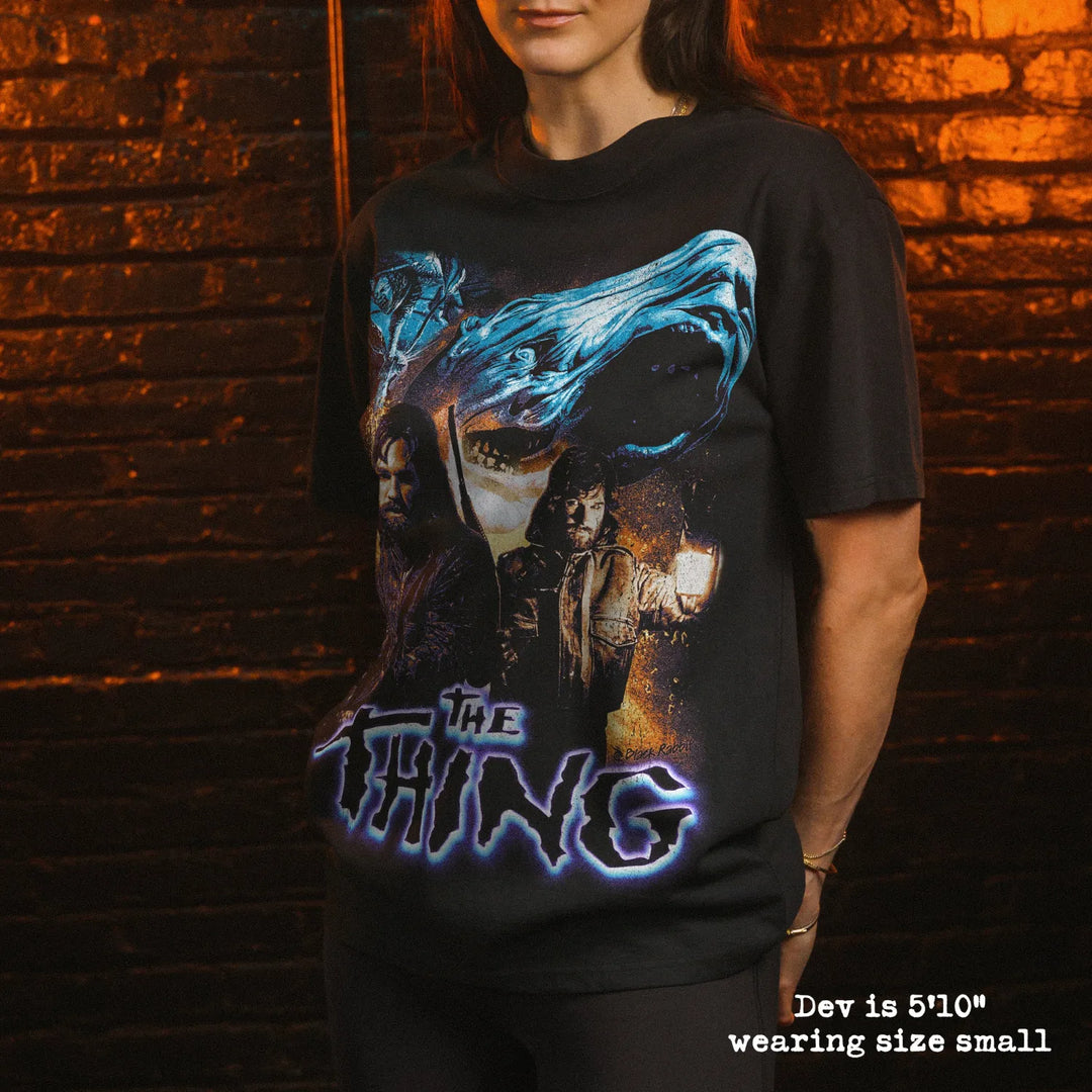 Model wearing heavy tee with the thing graphic 