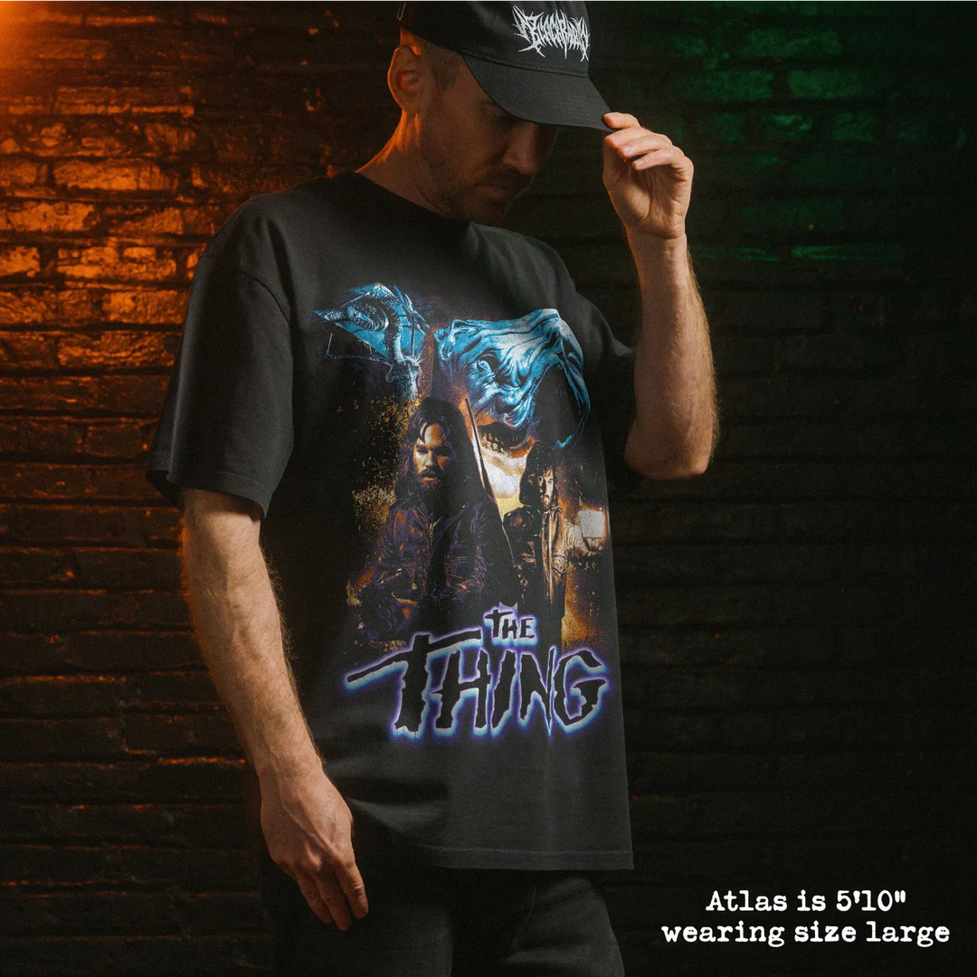 Model wearing heavy tee with the thing graphic 