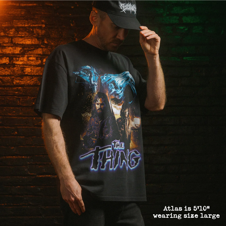 Model wearing heavy tee with the thing graphic 