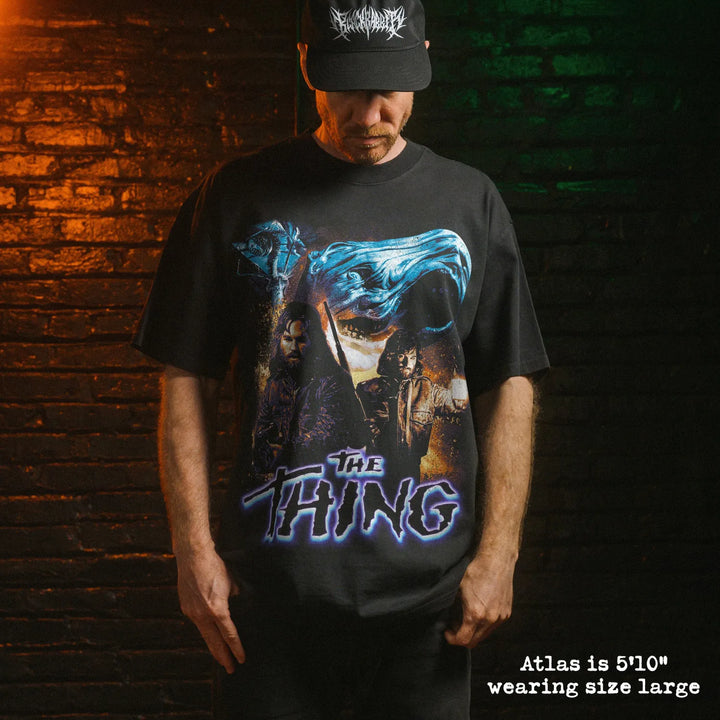 Model wearing heavy tee with the thing graphic 