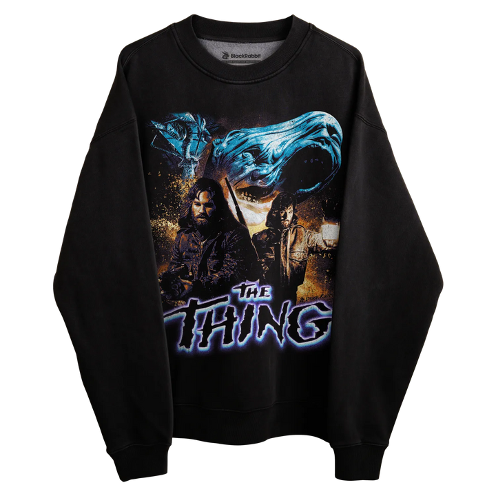 Black sweatshirt with ’the thing’ graphic design featuring a character and blue energy effect.