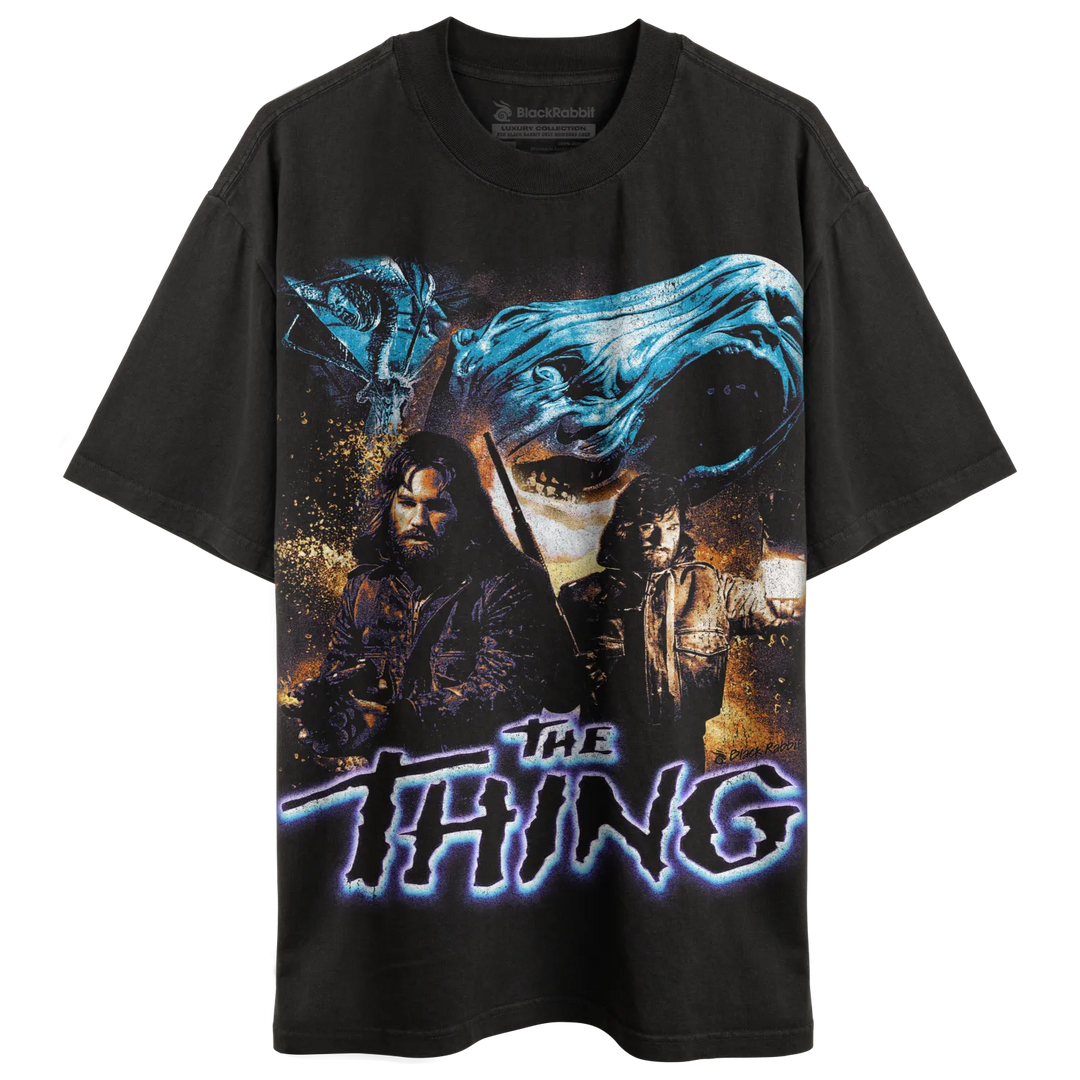 Black short-sleeved t-shirt with a vintage-style graphic of ’The Thing’ movie poster.