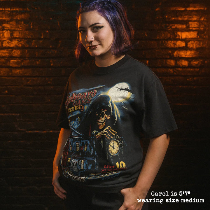Model wearing heavy tee with ghost tour graphic 