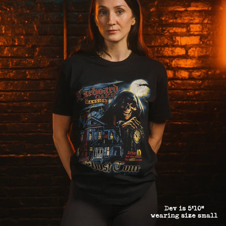 model wearing black premium tee with ghost tour graphic 