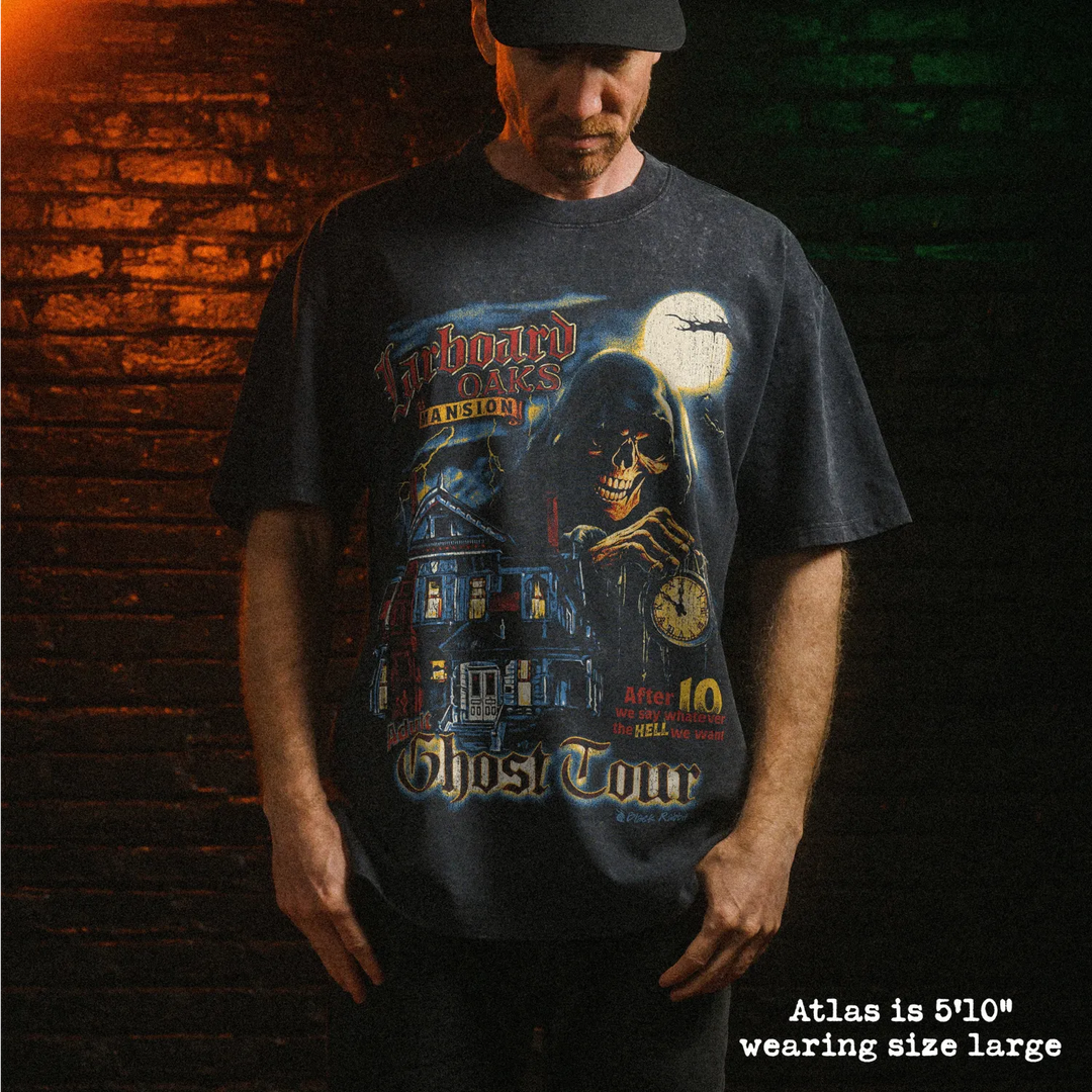 Male model wearing stone wash heavy tee with ghost tour graphic 