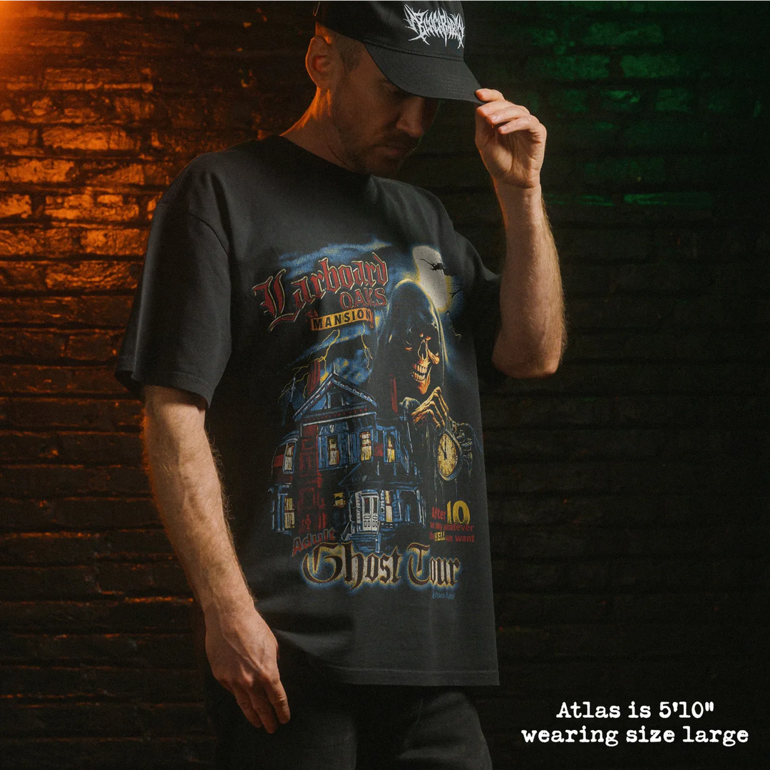 Model wearing heavy tee with ghost tour graphic 