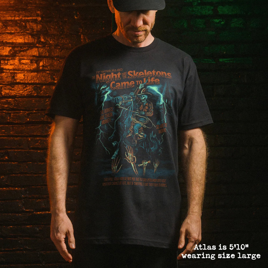 Male model wear soft premium tee with skeleton song graphic
