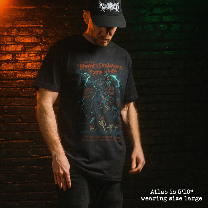 Male model wear soft premium tee with skeleton song graphic
