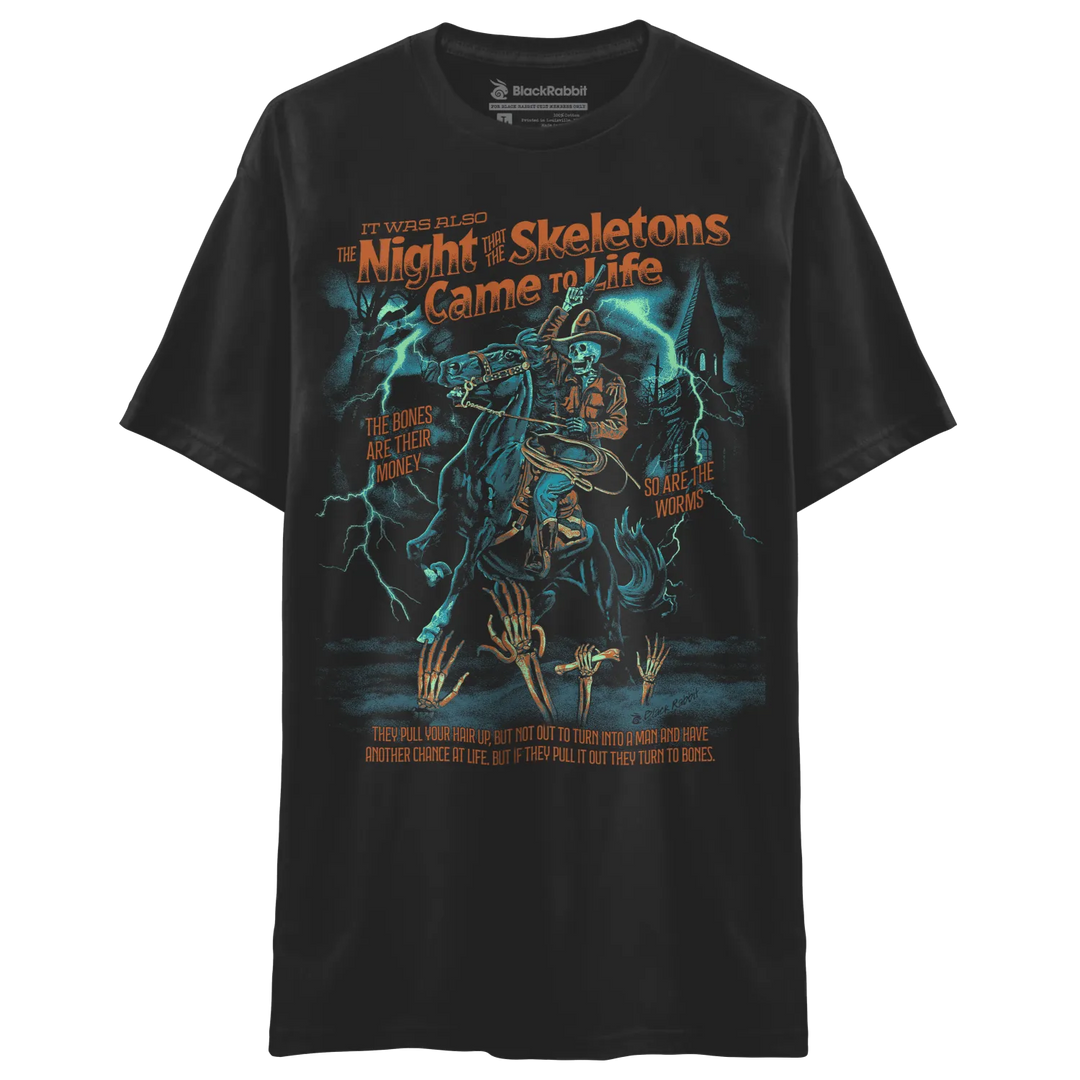 Black short-sleeved t-shirt with a vibrant graphic print of a skeleton cowboy on horseback amid lightning.