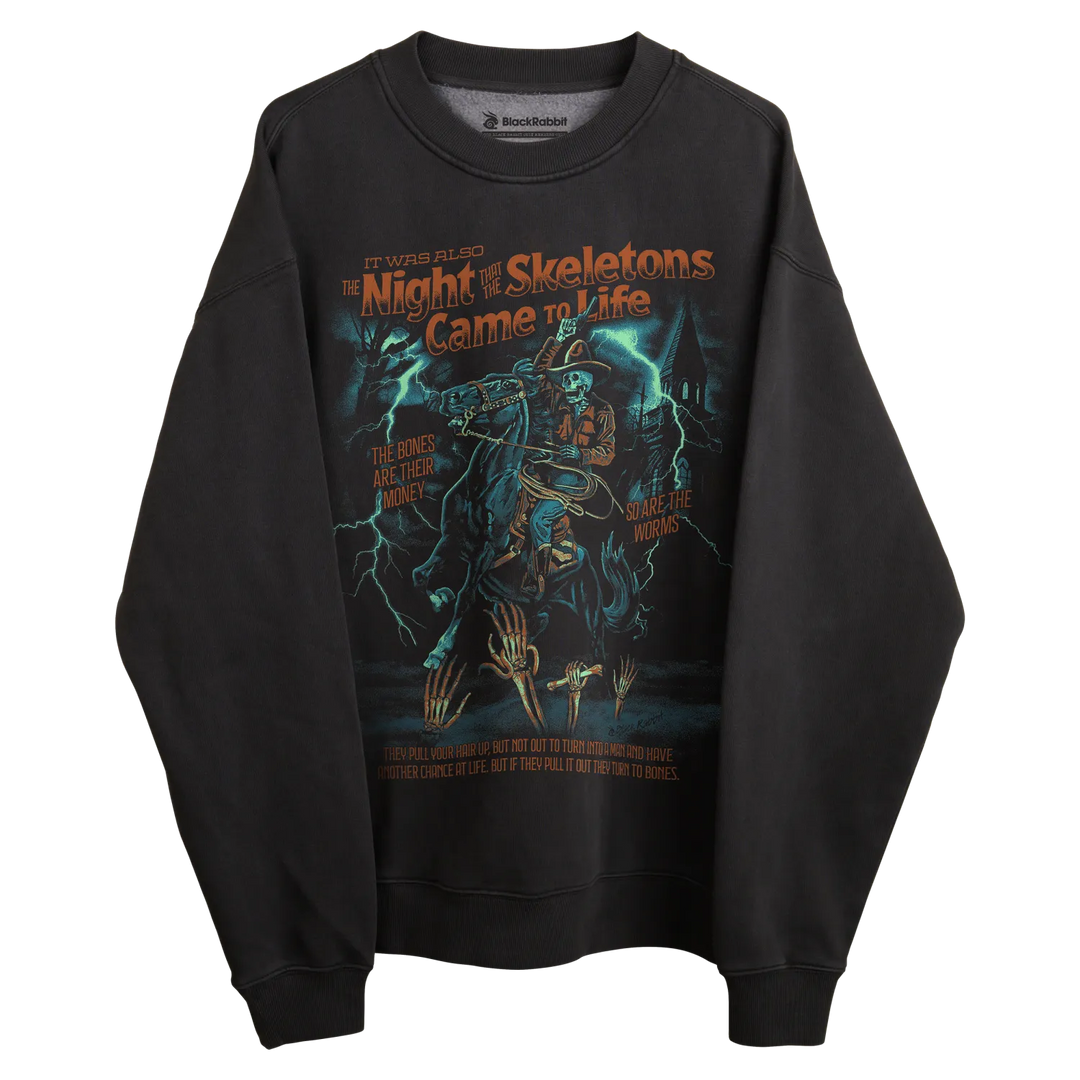 Black crewneck sweatshirt with skeleton design and lightning bolts, inspired by ’the night of skeletons came to life’ movie poster.