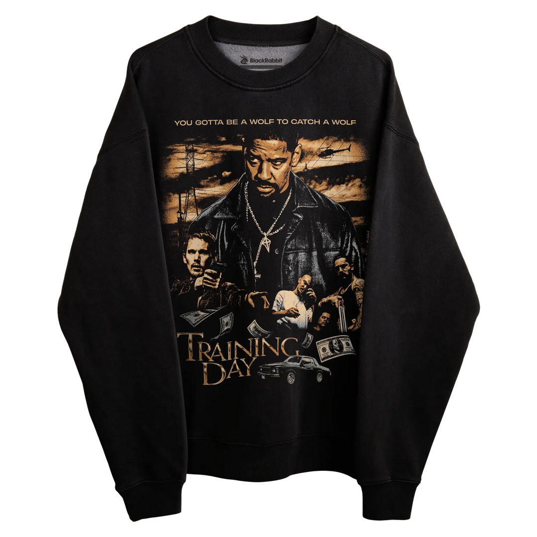 Black ’training day’ sweatshirt with graphic design featuring characters and quote.