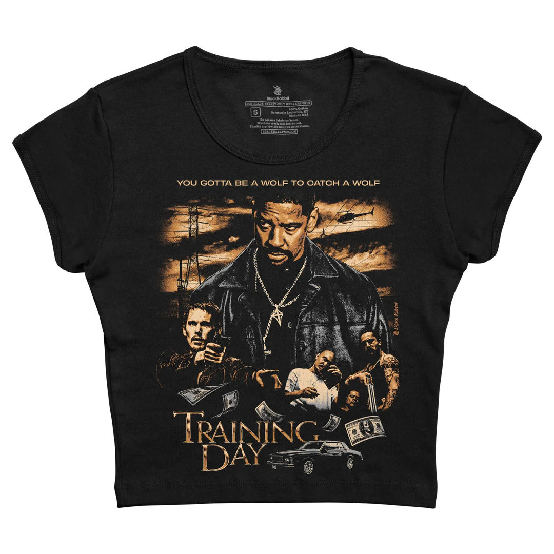 Black short-sleeved t-shirt featuring a graphic print of the movie ’training day’ with gold-toned text and imagery.