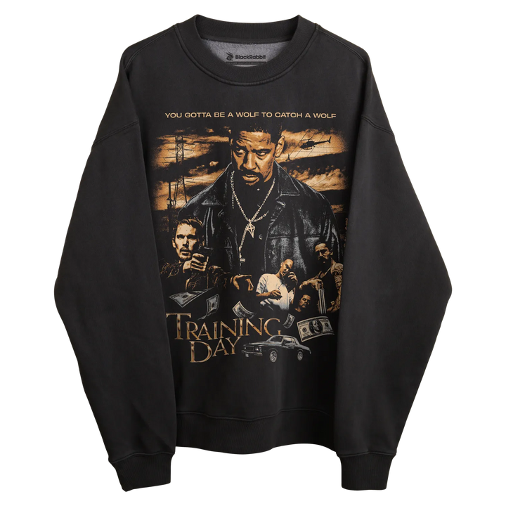 Black ’training day’ sweatshirt with graphic design featuring characters and quote.
