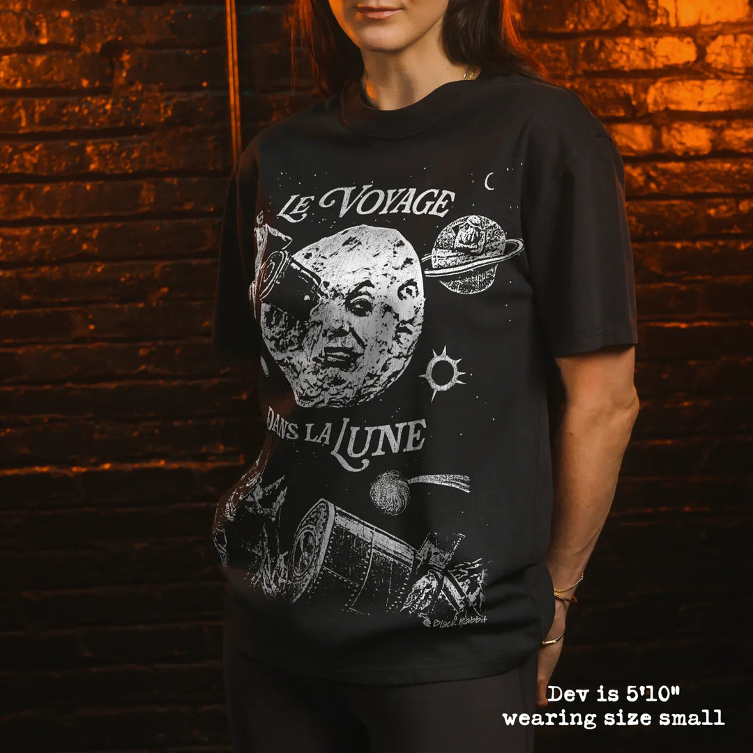 Model wearing heavy tee with A Trip to the Moon graphic 
