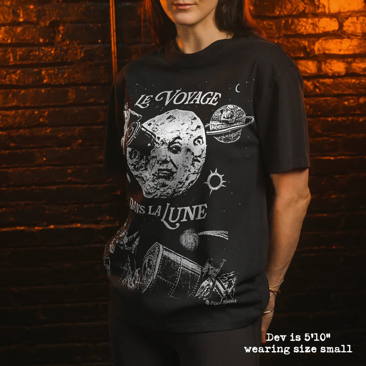 Model wearing heavy tee with A Trip to the Moon graphic 