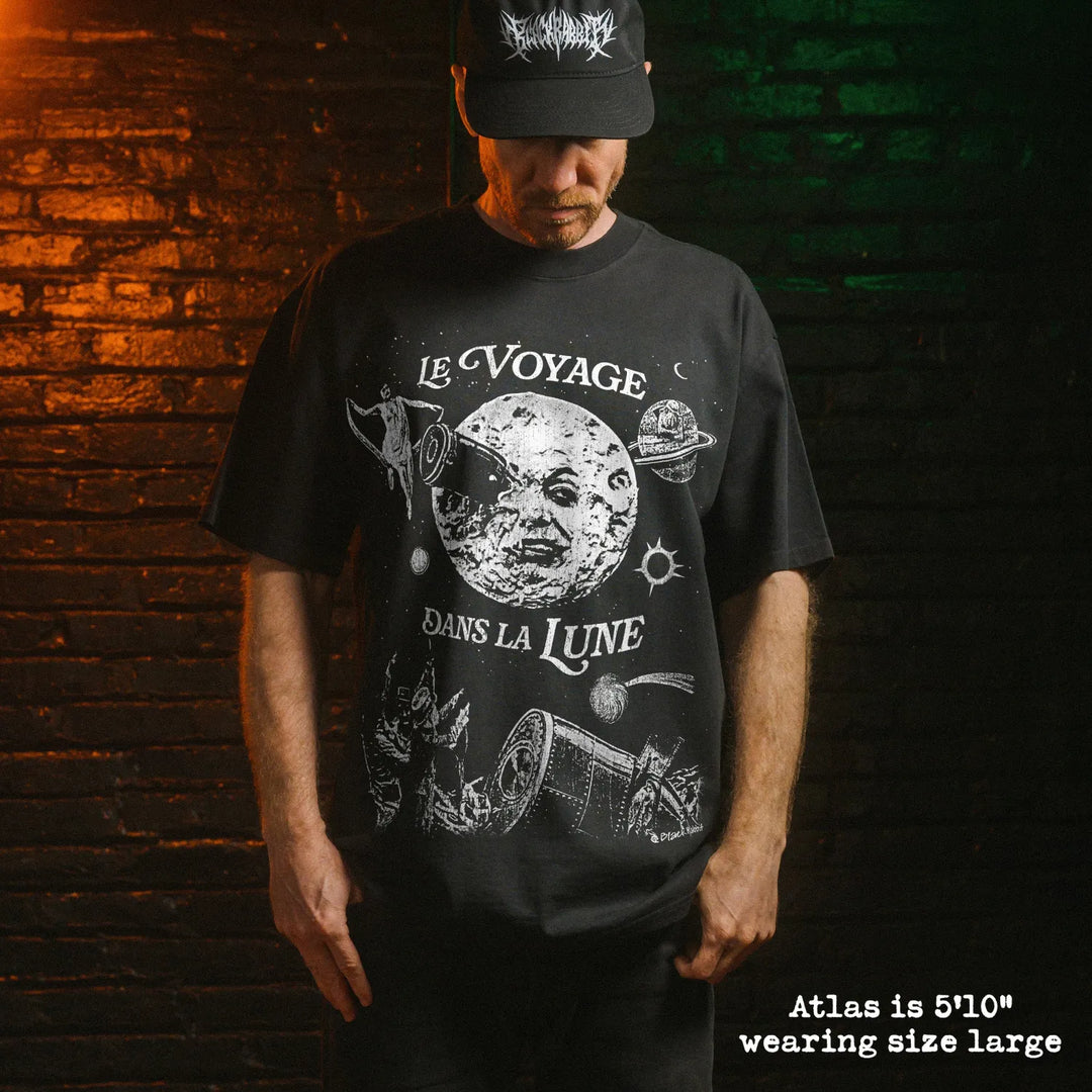 Model wearing heavy tee with A Trip to the Moon graphic 