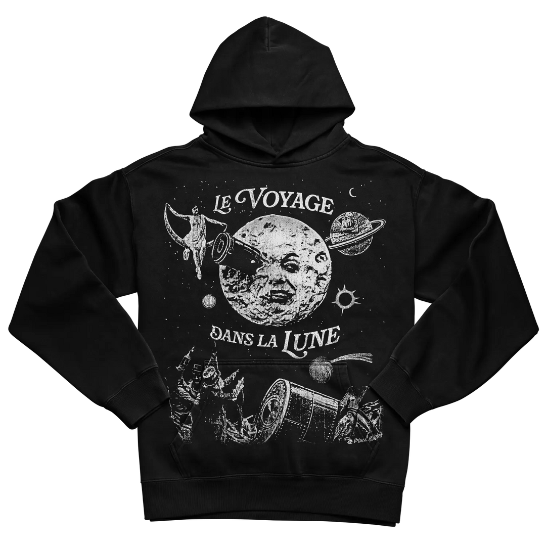 Black hoodie with white graphic design featuring ’le voyage dans la lune’ and celestial imagery.