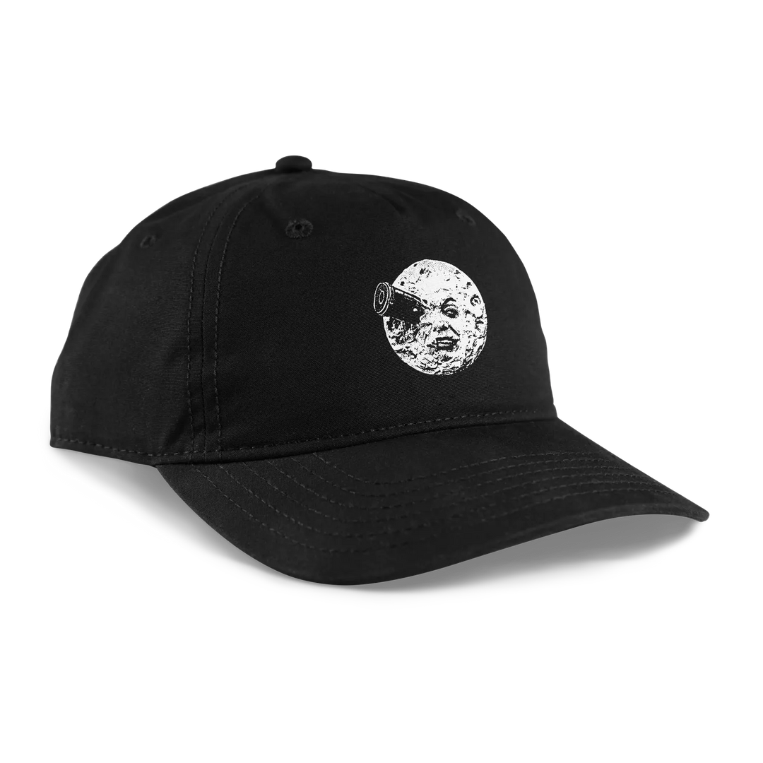 A black unstructured cap featuring a white graphic of a moon with a human face 