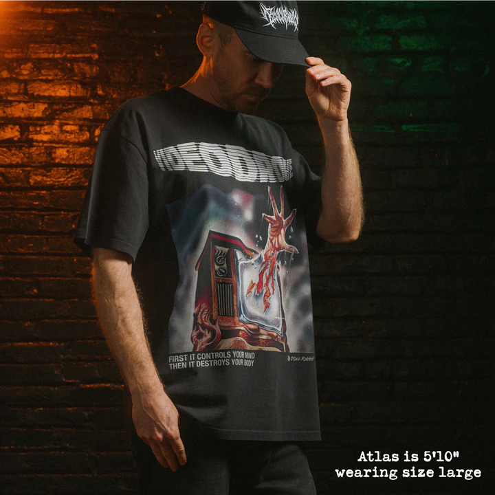 Model wearing heavy tee with videodrome graphic 