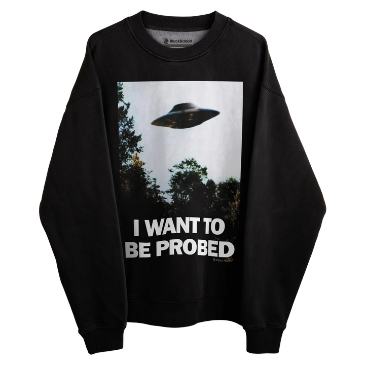Black sweatshirt with ufo design and text ’i want to be probed’ in white.