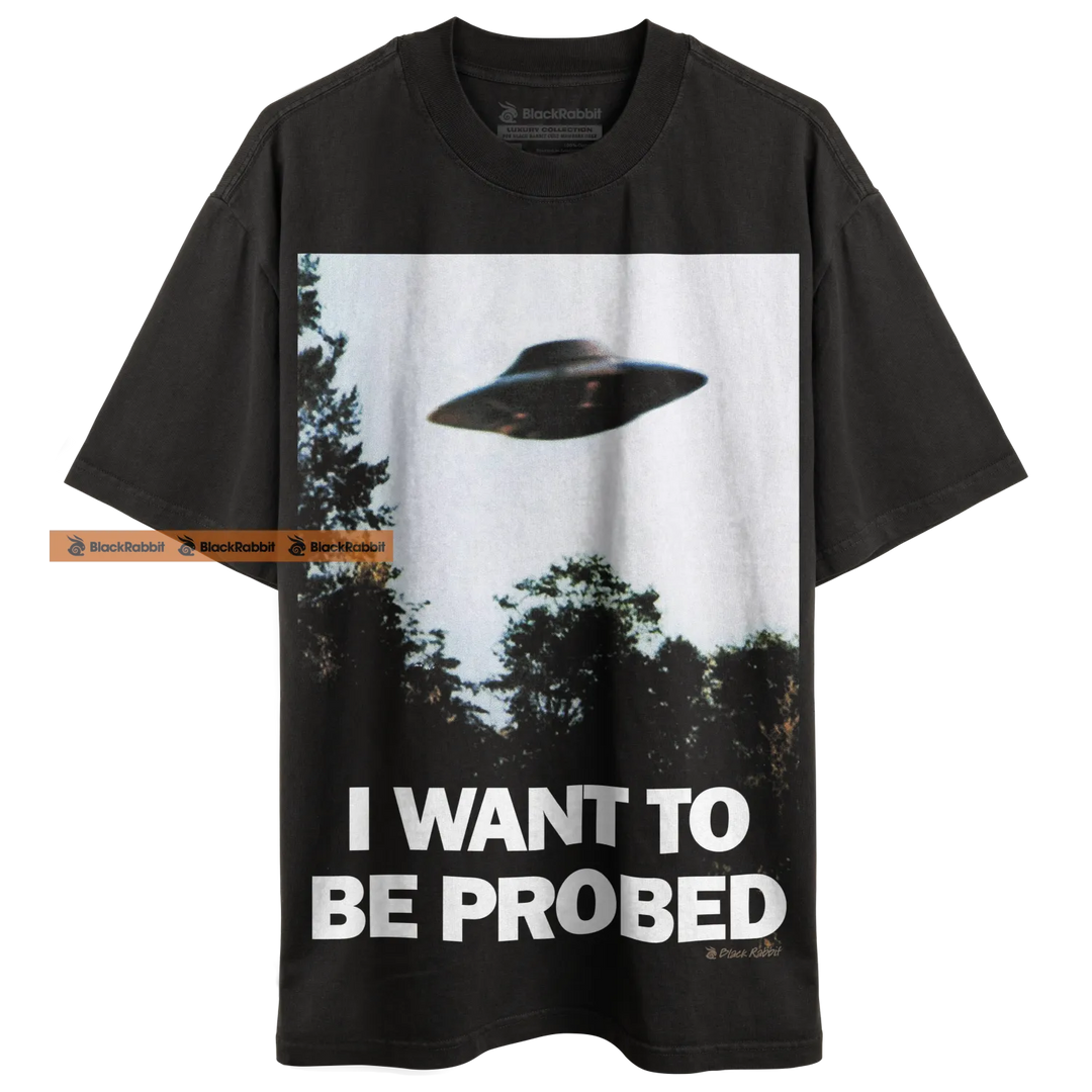 Black t-shirt with UFO graphic.