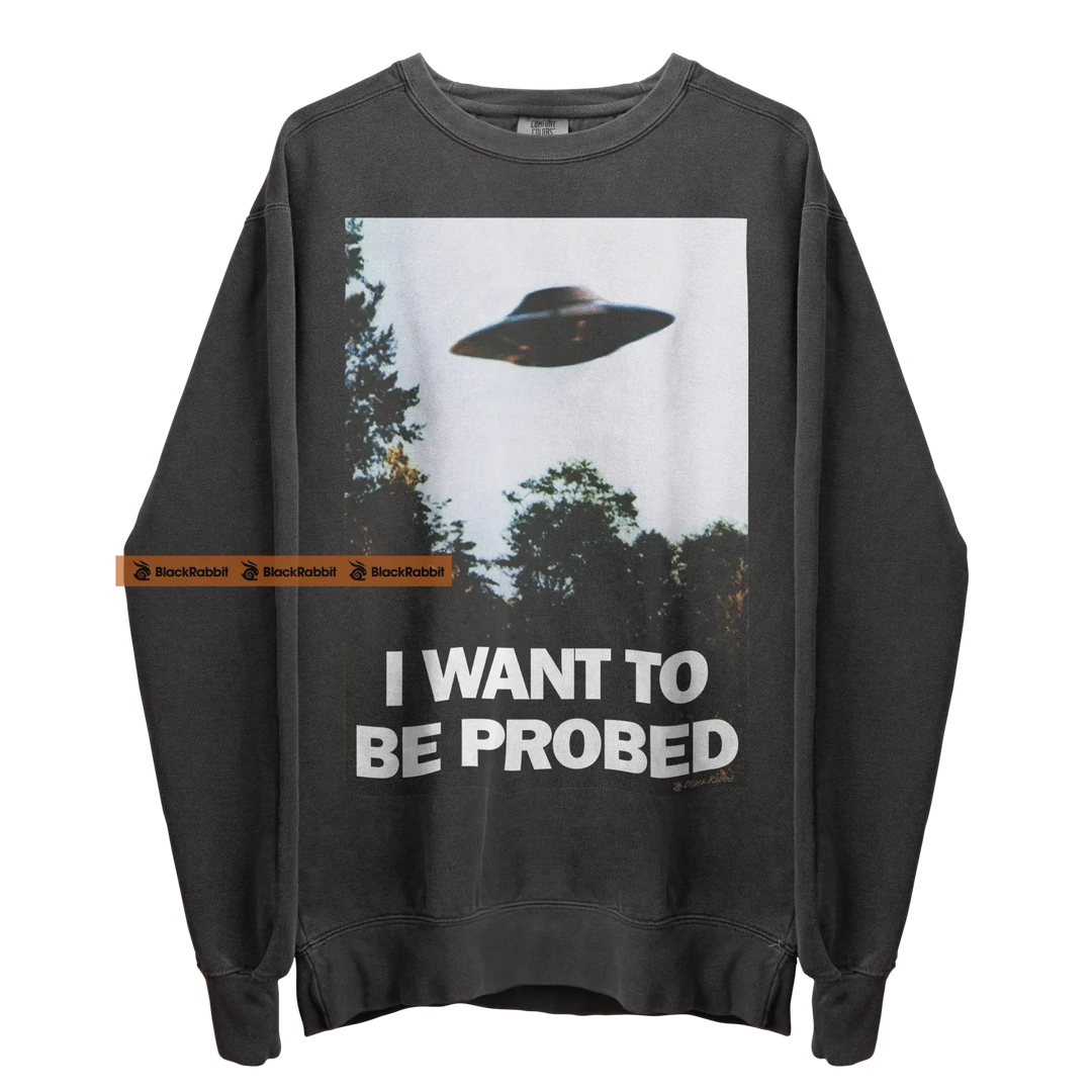 Gray sweatshirt with UFO graphic.