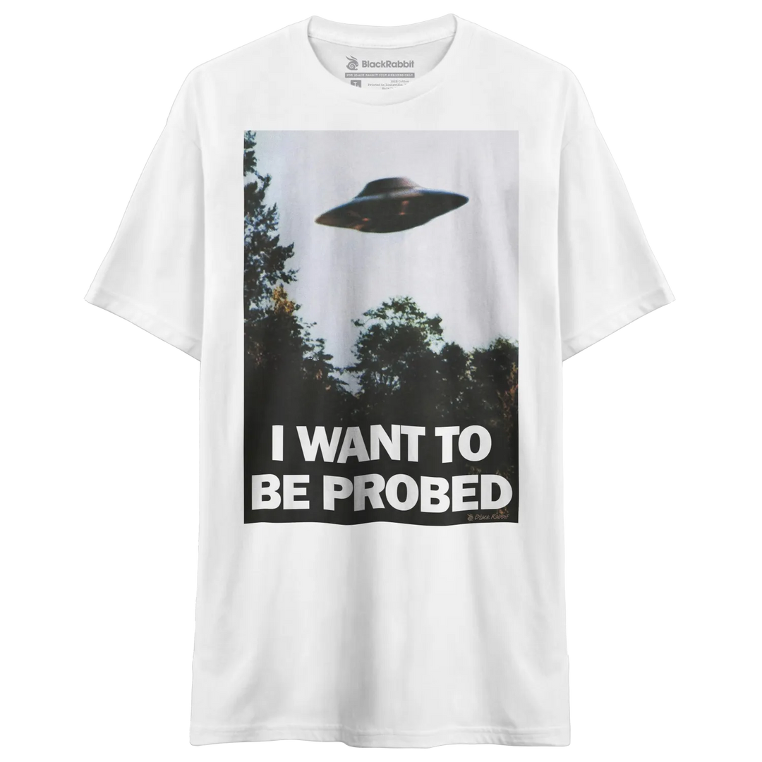 White t-shirt with ufo graphic and text ’i want to be probed’