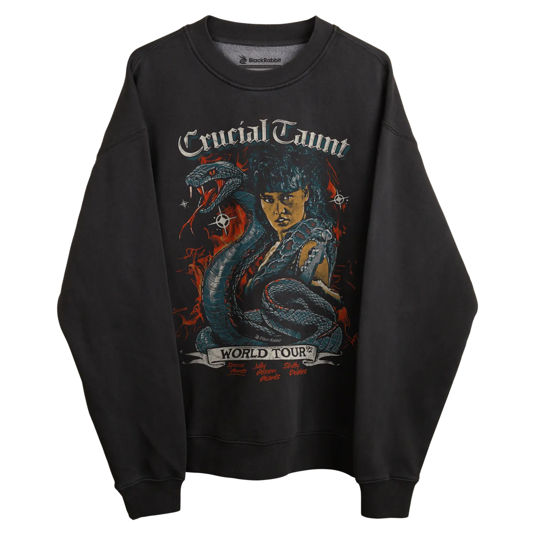 Black sweatshirt with ’crucial taunt world tour’ graphic design featuring a woman and snake, rockabilia brand.