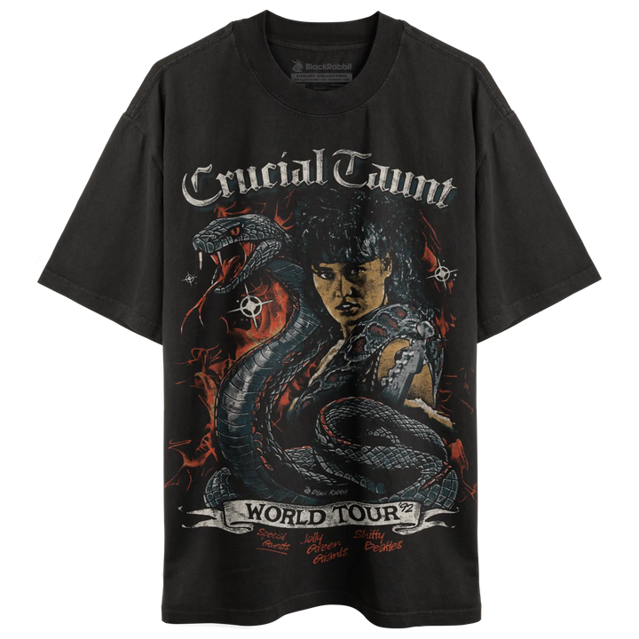 Dark grey oversized t-shirt with a graphic print featuring a woman, a snake, and ’Crucial Taunt World Tour’ text.